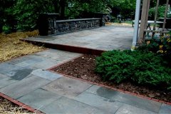 Landesign-Hardscape-Masonry-Valley-Forge-Dryset-Flagstone-Patio-with-Masonry-seating-wall
