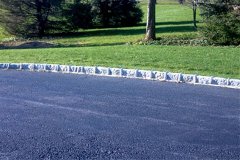 Landesign-Hardscape-Masonry-Valley-Forge-Cobblestone-border-along-the-side-of-a-driveway