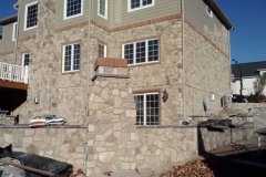 Landesign-Hardscape-Masonry-Valley-Forge-After-stone-house-with-a-brick-boarder-outdoor-fireplace