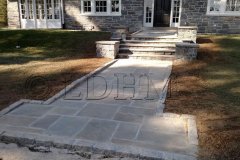 Landesign-Hardscape-Masonry-Valley-Forge-After.-Flagstone-walkway-in-concrete-with-steps-and-columns-bordered-on-Belgian-Block.-Haverford-PA